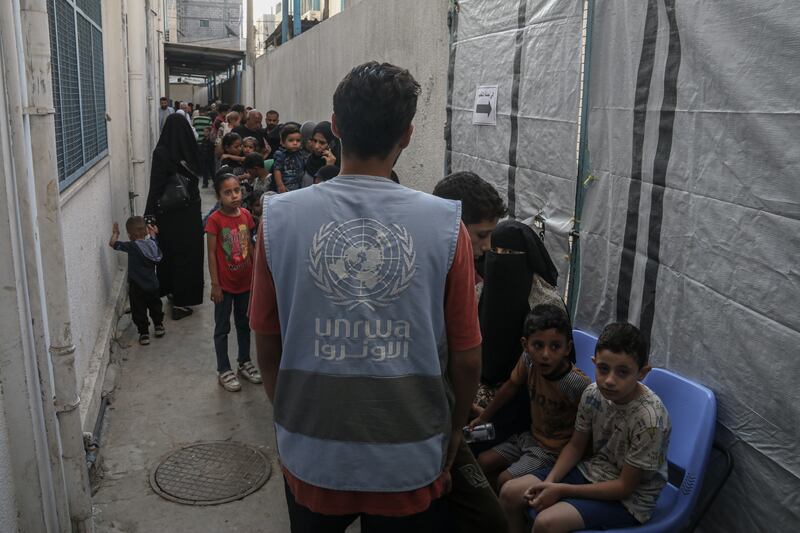 Children wait in line to receive a vaccination against polio, during a break in fighting, at the United Nations Nuseirat Health Center, in Gaza's Nuseirat refugee camp on Sunday. Photograph: Ahmad Salem/Bloomberg