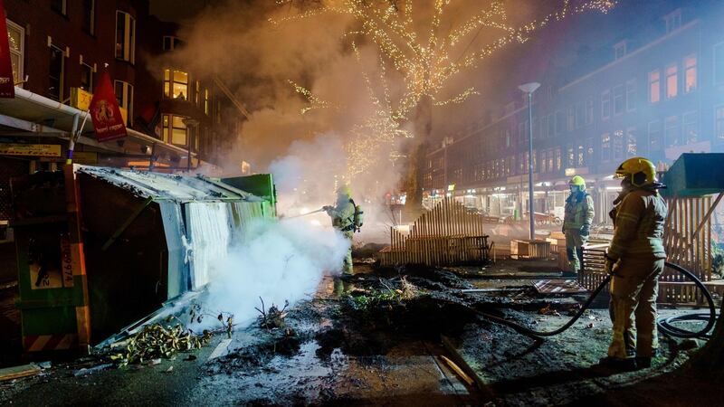 Firefighters work to extinguish a fire on the Groene Hilledijk in Rotterdam on Monday. Photograph: Marco de Swart/ANP/AFP via Getty Images
