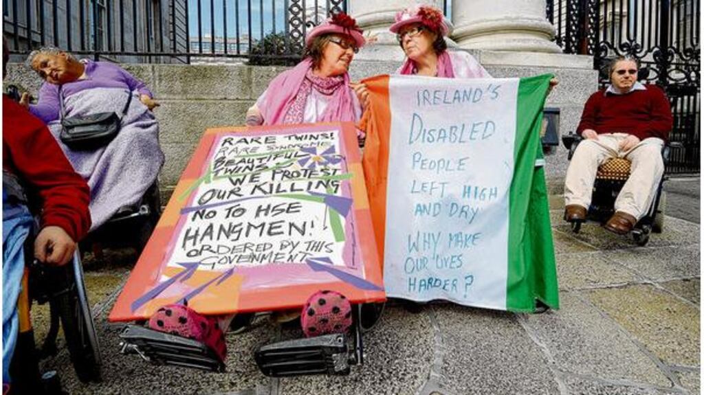 Disability protesters outside Leinster House last September. Taoiseach Enda Kenny said the current mobility allowance scheme was being replaced as it was illegal, discriminatory and not in compliance with the Equal Status Act and the Disability Act but he insisted that the €10 million funding for the scheme would be ring-fenced. photograph: cyril byrne