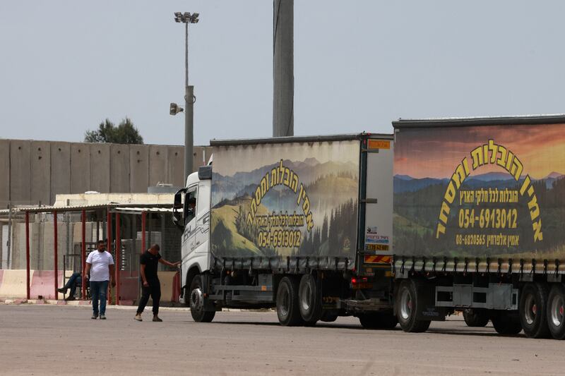 Trucks carrying humanitarian aid wait at the Israeli side of the Kerem Shalom border crossing with the Gaza Strip in southern Israel on Tuesday. Photograph: Menahem Kahana/AFP via Getty Images