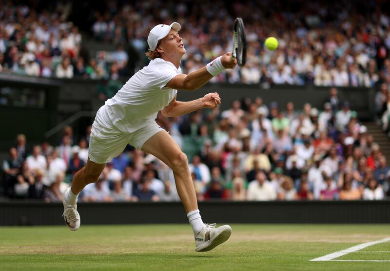 Jannik Sinner plays a forehand against Novak Djokovic during the quarter-final on Centre Court. Photograph: Julian Finney/Getty Images