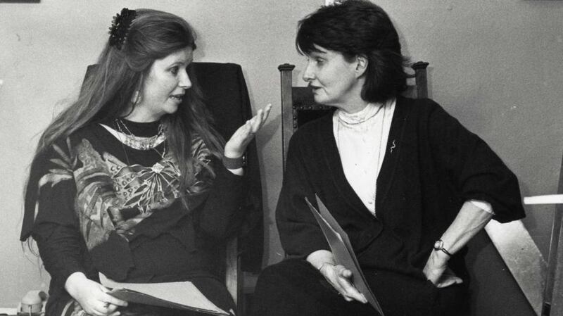 Poets Nuala Ní Dhomhnail (left) and Eavan Boland at the Mna na hEorpa poetry reading celebration by Irish women poets marking the occasion of International Women’s Day in the Abbey Theatre attended by President Mary Robinson in 1992. Photograph: Matt Kavanagh
