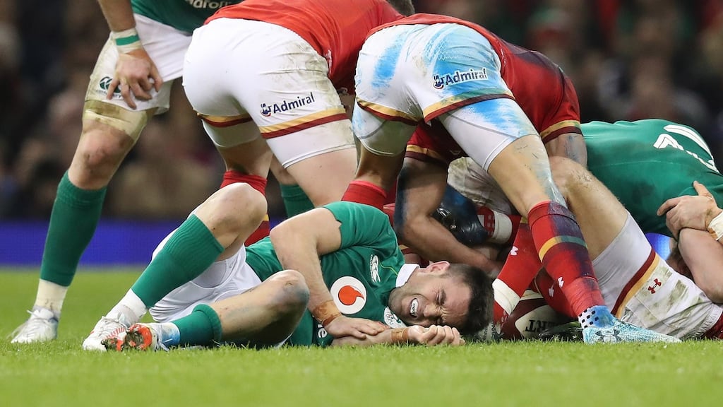 Conor Murray tried to play through the pain in Cardiff but was removed early in the second half as Wales all but ended Ireland’s Six Nations title hopes. Photograph: Billy Stickland/Inpho