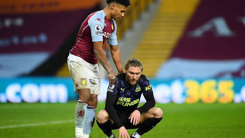 Ollie Watkins consoles Jeff Hendrick after Aston Villa’s win over Newcastle. Photograph: Clive Mason/Getty