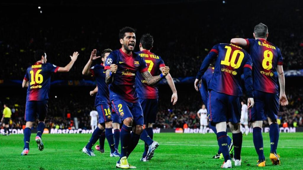 Barcelona players celebrate after Lionel Messi scores his team's second goal against AC Milan. Photograph: David Ramos/Getty Images