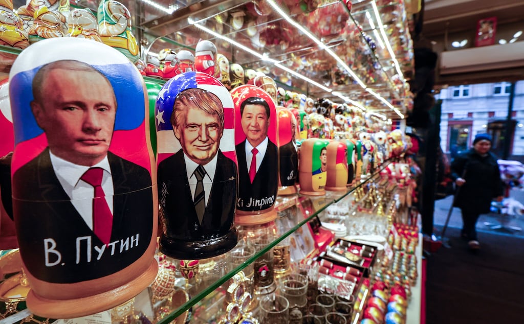 Traditional Russian wooden dolls depicting world leaders including Vladimir Putin, Donald Trump and Xi Jinping on display at a gift shop in Moscow. Photograph:
Yuri Kochetkov/EPA