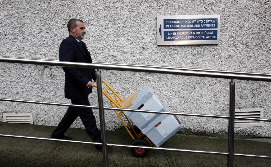 Willie O’Donnell, service attendant at Dublin Castle, wheels out the transcripts from the final day of the Mahon Tribunal at the castle in October 2008. Photograph: Eric Luke