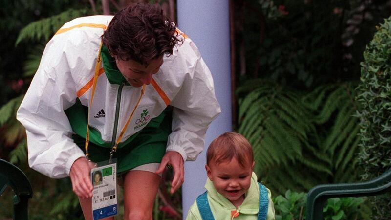 Sonia O’Sullivan and her daughter Ciara with the silver medal the morning after the 5,000 metres final at the 2000 Sydney Olympics. Photograph:  Patrick Bolger/Inpho