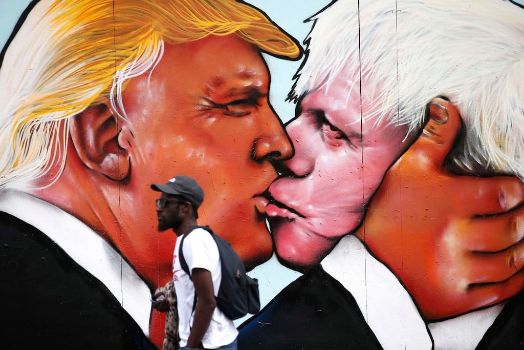 It couldn't happen to a nicer couple. A mural of Donald Trump embracing Boris Johnson on a building in Bristol, Britain. Photograph: Peter Nicholls/Reuters