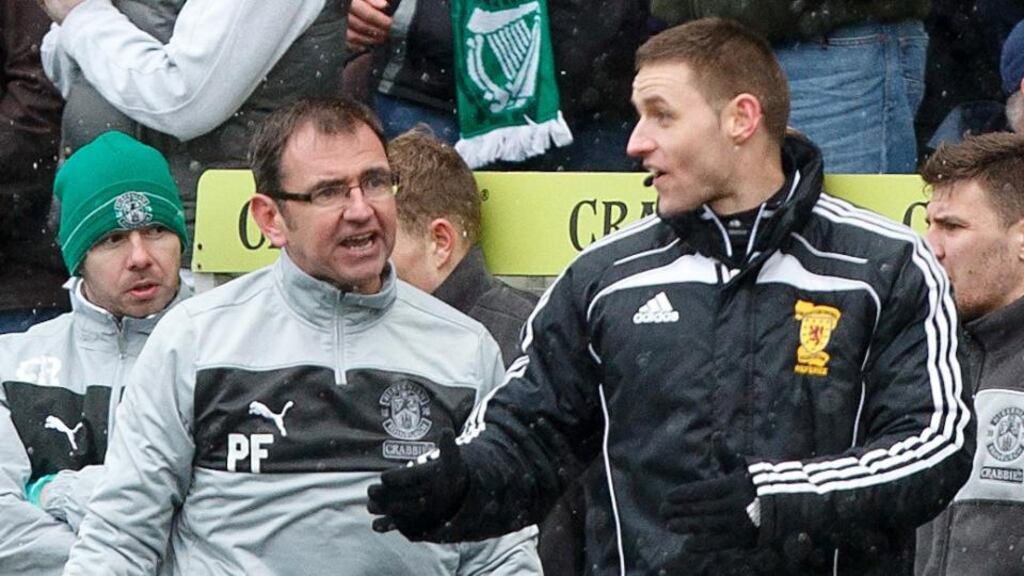 Hibernian manager Pat Fenlon argues with the fourth official Steven McLean during the Scottish Premier League match at Easter Road. Photograph: Chris Clark/PA