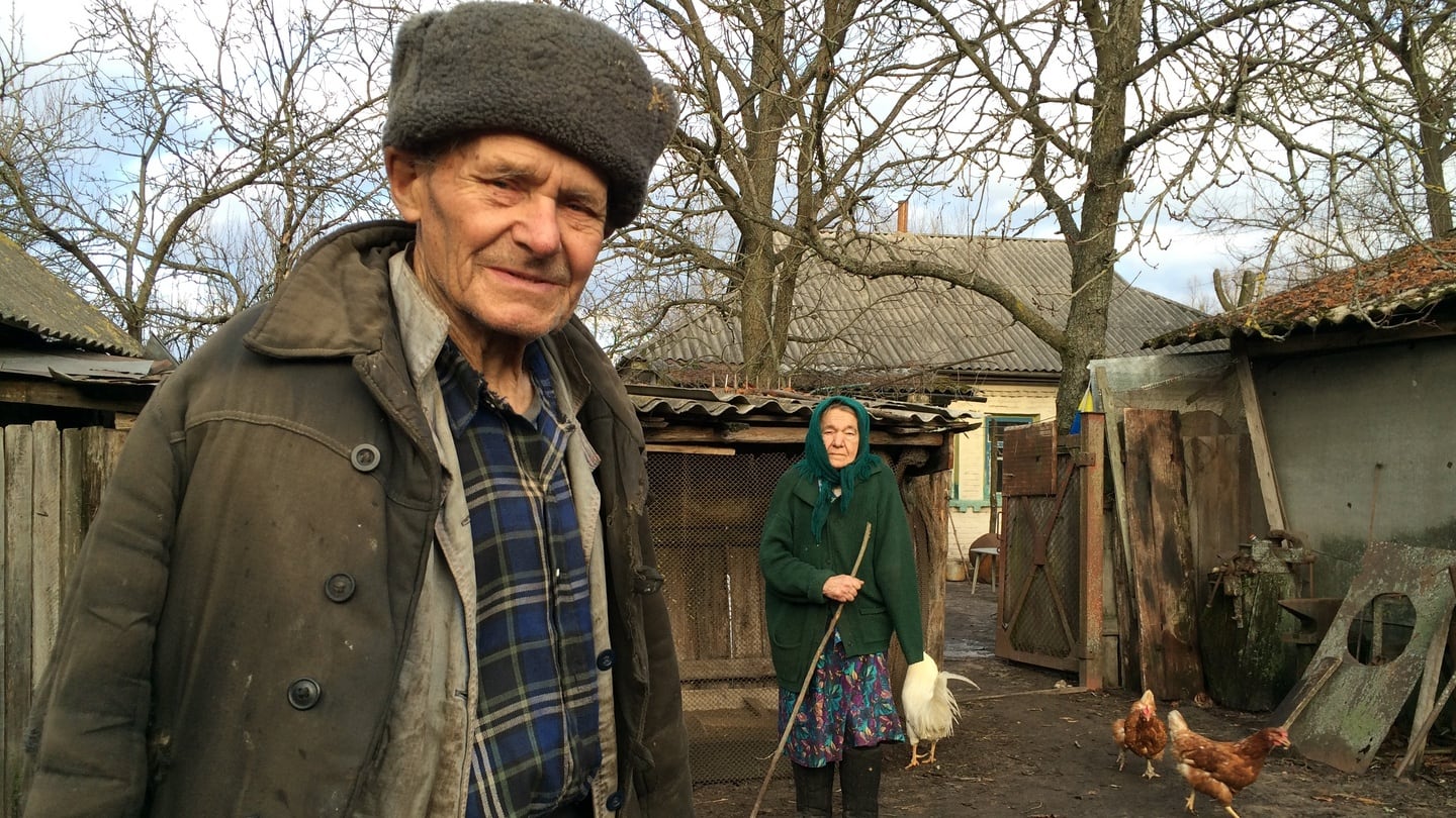 Ivan and Maria Semenyuk, who live in a cabin in the remote village of Paryshev, 25km from the Chernobyl nuclear power plant. Photograph: Dan McLaughlin