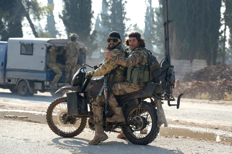 Jihadists drive on the international M5 highway in the area Zarbah  which was taken over by anti-government fighters on Friday, as Hayat Tahrir al-Sham jihadists and allied factions continue their offensive in Syria's northern Aleppo province against government forces. Photograph: Rami al Sayed/AFP