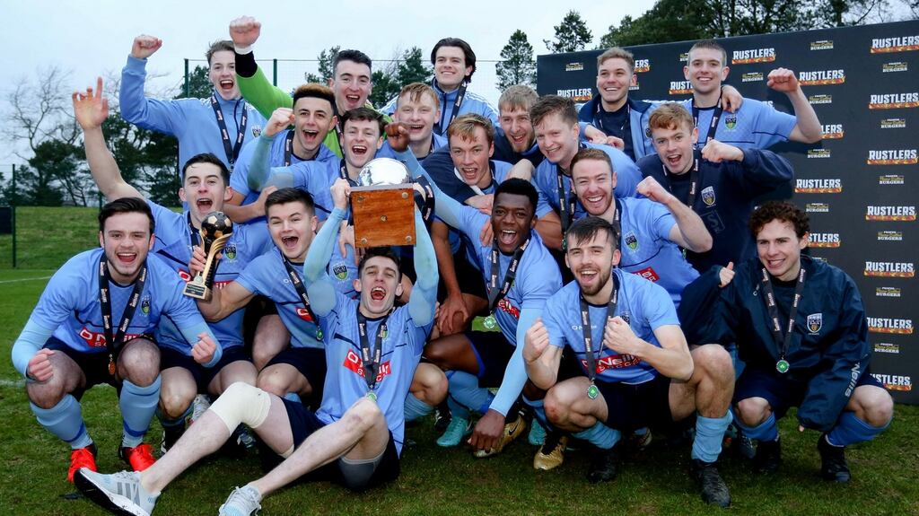 UCD celebrate with the Collingwood Cup after their win over Queens. Photograph: Philip Magowan/Inpho