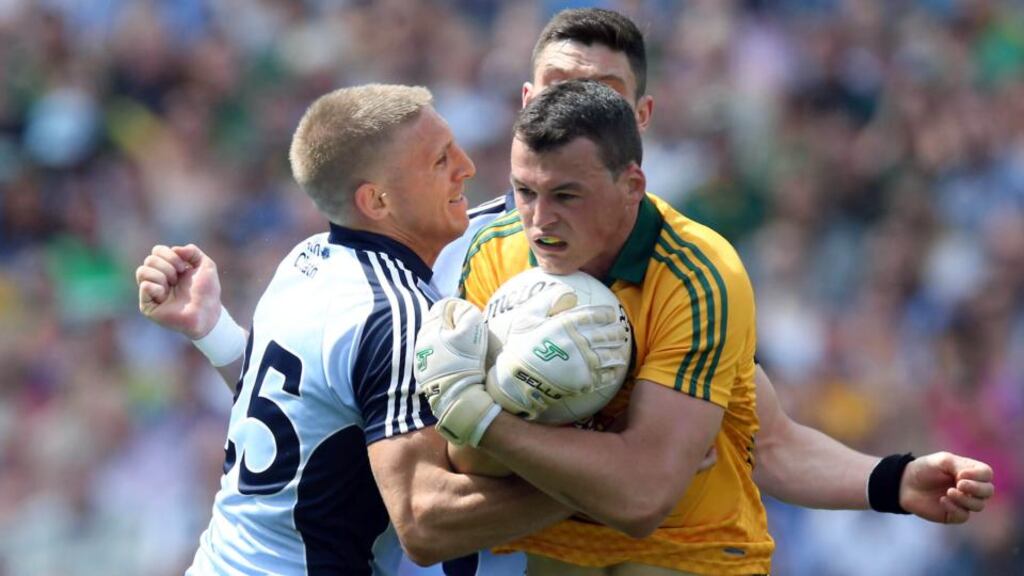 Meath goalkeeper Paddy O’Rourke with Eoghan O’Gara and Diarmuid Connolly. Photograph: Donall Farmer/Inpho