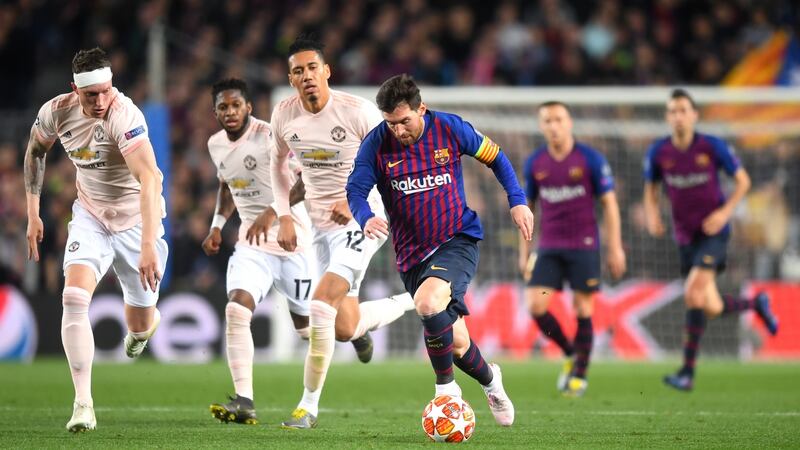 Lionel Messi runs away from Chris Smalling, Fred and Phil Jones at the Nou Camp. Photograph: Michael Regan/Getty Images