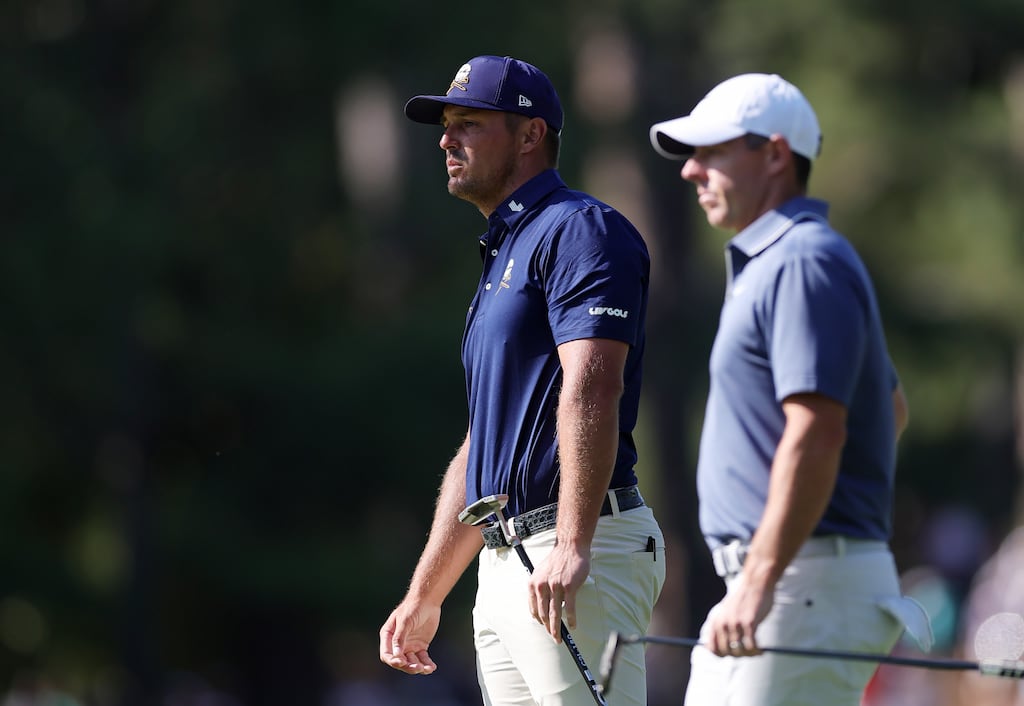 Bryson DeChambeau of the United States and Rory McIlroy of Northern Ireland wait on the 10th hole at the Masters. Photograph: Andrew Redington/Getty