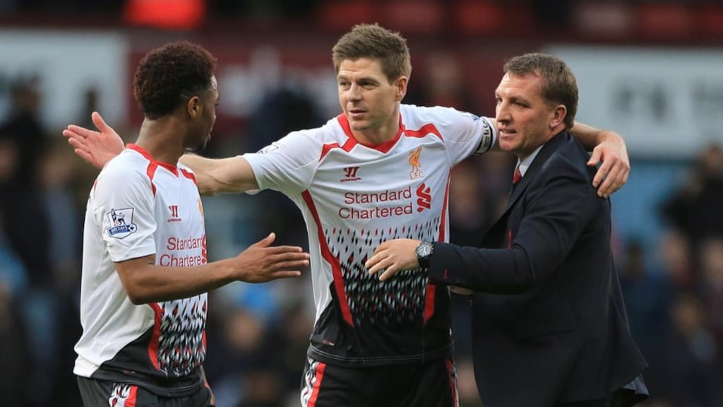 Liverpool manager Brendan Rodgers (right) celebrates with team-mates Raheem Sterling (left) and Steven Gerrard after the win over West Ham. Photograph: Nick Potts/PA Wire