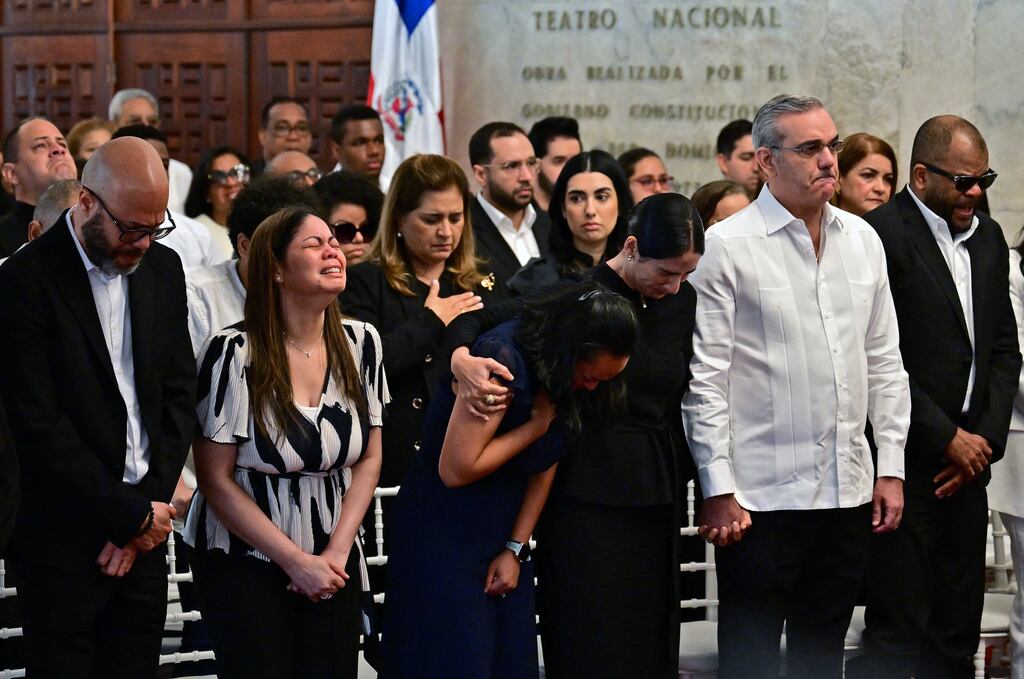 Relatives of singer Rubby Perez, and the Dominican Republic's president Luis Abinader (second from right) and his wife Raquel Arbaje (third from right) attend the wake of the famed merengue singer, who died after the roof of the Jet Set nightclub, where he was performing, collapsed on Tuesday. Photograph: Martin Bernetti/AFP via Getty Images