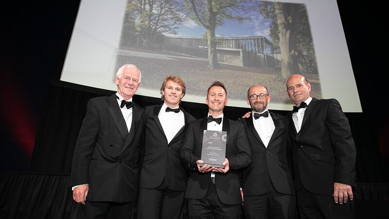 Stephen Pierce, Irish Sales Agent, Vescom, presents the Building of the Year – Tourism, Leisure & Hospitality award to the Healy Partners Architects team.