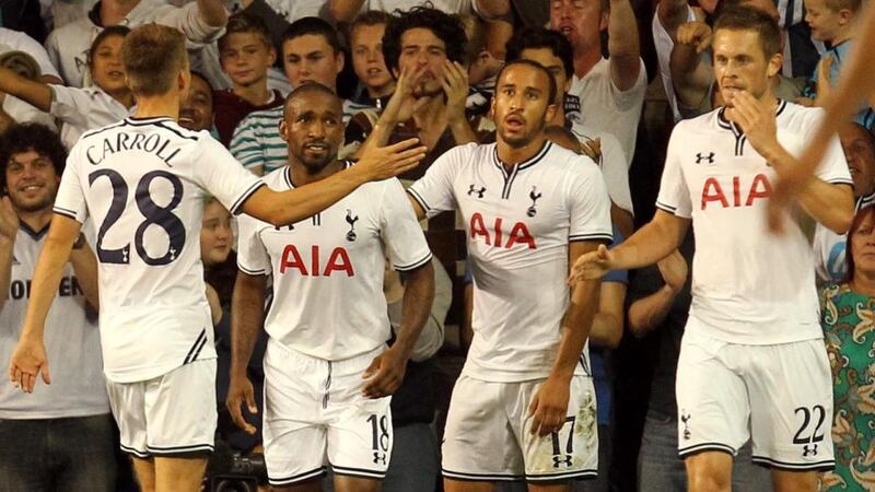 Jermain Defoe (second left) celebrates his second goal with team-mates at White Hart Lane. Photograph: Sean Dempsey/PA Wire
