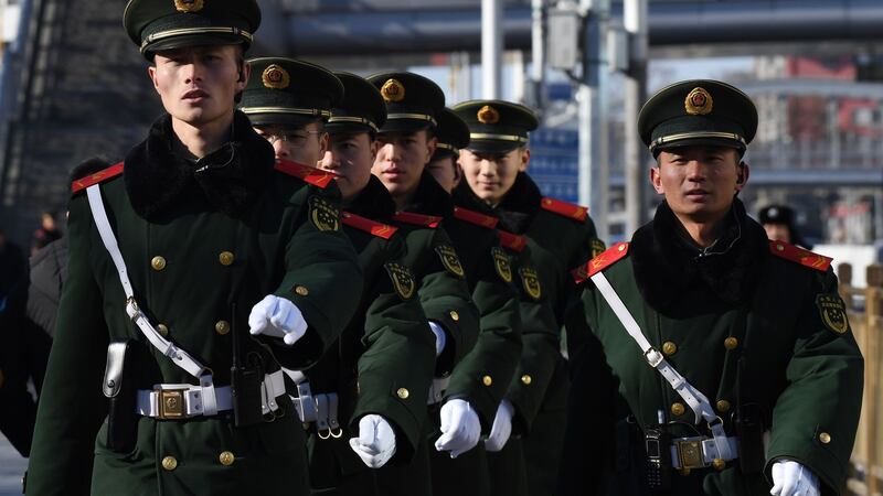Paramilitary police officers outside Beijing Railway Station after the arrival of North Korean leader Kim Jong-un. Photograph: Greg Baker/AFP/Getty Images