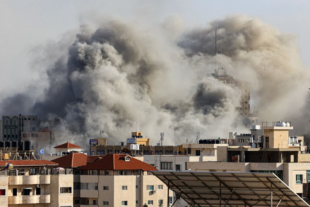 Smoke plumes rise over Gaza city during Israeli air strikes. Photograph: Mahmud Hams/AFP via Getty Images