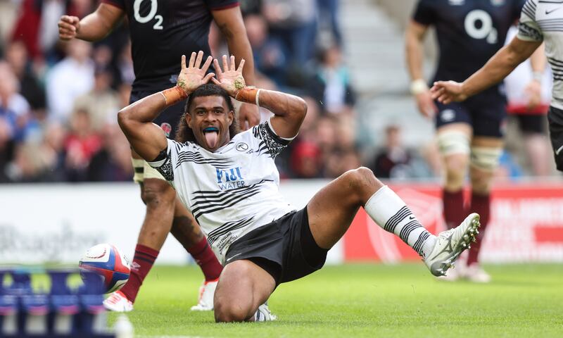 Fiji's Simione Kuruvoli celebrates after scoring a try against England. Photograph: Andrew Fosker/Inpho