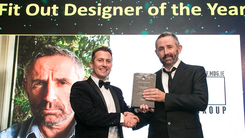 Stephen Pierce, Senior Area Manager, Ireland, Vescom Wallcoverings & Fabrics, presents the Fit Out Designer of the Year award to Barry McCabe, McCabe Design Group.