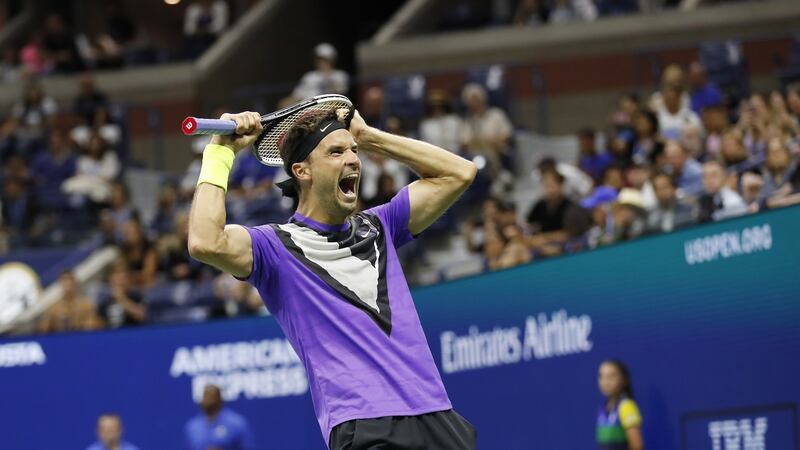 Grigor Dimitrov celebrates his victory over Roger Federer. Photograph: John G Mabalnglo/EPA