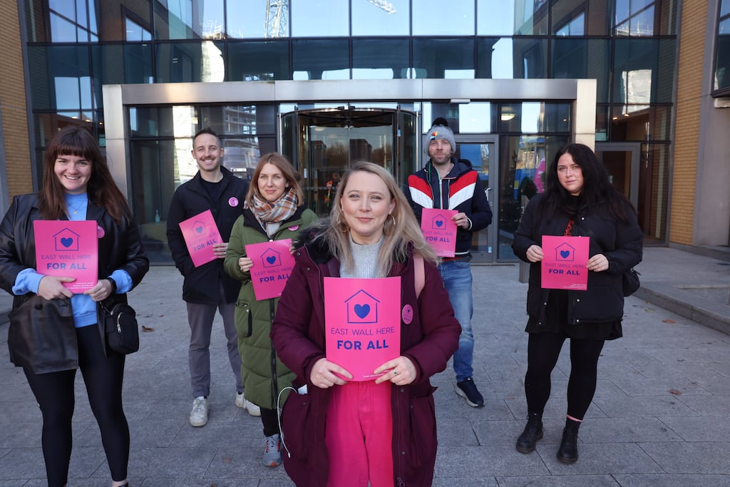 From left are Heather Harte, Paddy O’Dea, Jane Dunne, Roxanna Nic Liam, Alan Whelan and Molly Hennessey, of East Wall Here For All, outside the old ESB office block which has been used to house asylum seekers. Photograph: Dara Mac Dónaill
