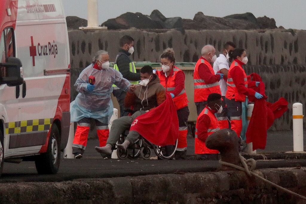 Red cross members help migrants as they arrive at the port in Arrecife, Canary Islands earlier this year after being rescued at sea by Spanish authorities. Photograph: EPA