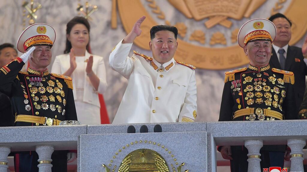 Kim Jong-un watches a military parade to mark the 90th anniversary of North Korea’s army at the Kim Il-sung Square in Pyongyang on Monday. Photograph: Korean Central News Agency/Korea News Service via AP