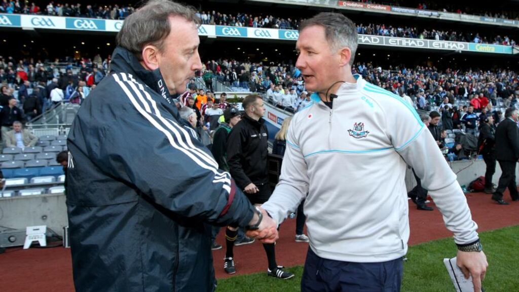 Westmeath Manager Pat Flanagan and Dublin Manager Jim Gavin shake hands after the game. Photograph: Ryan Byrne/Inpho