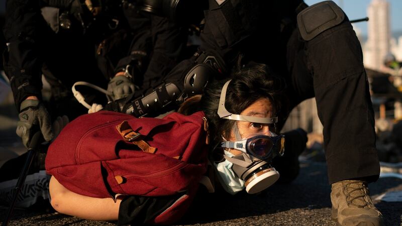 Police detain an anti-government protester in Hong Kong on Tuesday. Photograph: Felipe Dana/AP