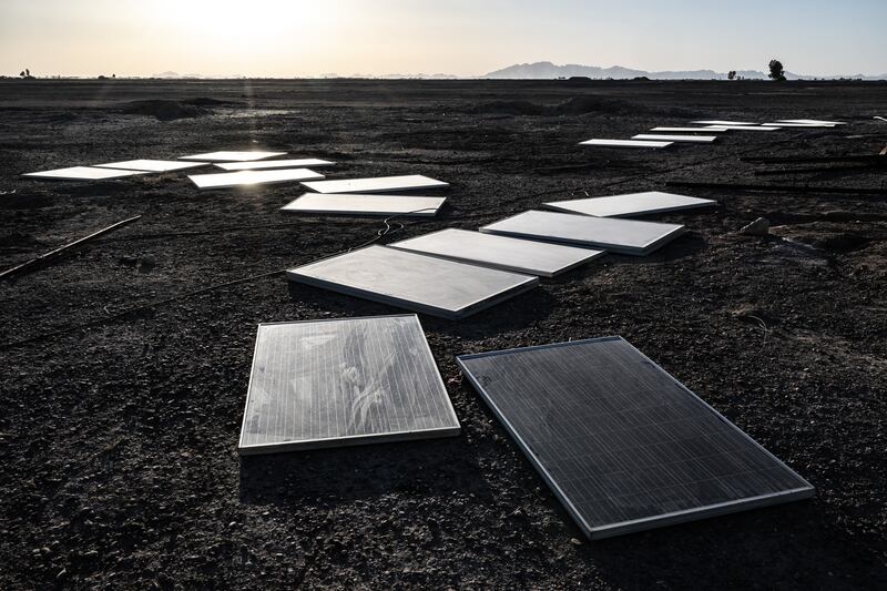 Some of the many solar panels that once powered water pumps enabling southwest Afghanistan’s arid Bakwa district to briefly become a hub of the global narcotics trade, now readied for transport elsewhere on April 22nd, 2023. The Bakwa’s drug trade was once permitted and taxed by the Taliban. Now it is forbidden again, but another factor had already taken a toll: the water is running out. Photograph: Bryan Denton/The New York Times