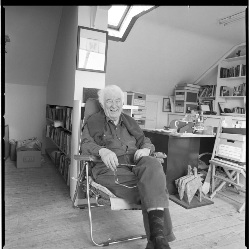 In the Attic: Seamus Heaney in his study at the family home in Sandymount, in Dublin. The Heaney family have loaned his desk to the National Library for the exhibition Seamus Heaney: Listen Now Again. Photograph © Bobbie Hanvey; courtesy National Library of Ireland