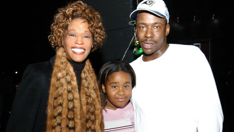 Whitney Houston with her daughter Bobbi Kristina Brown and husband Bobby Brown. Photograph: Frank Mullen/WireImage