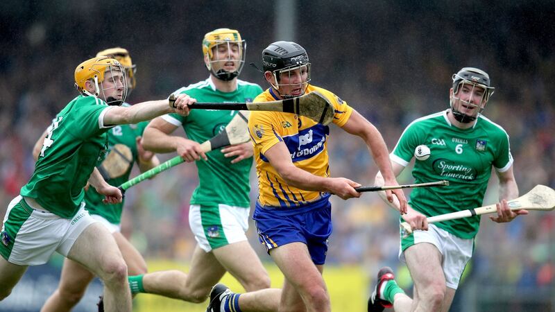 Clare’s Cathal Malone and Richie English of Limerick in action in Ennis. Photograph: Bryan Keane/Inpho