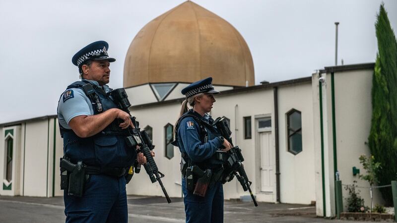Armed police stand guard at Al Noor mosque in Christchurch, New Zealand after it was officially reopened following last weeks terror attack. Photograph: Carl Court/Getty Images.
