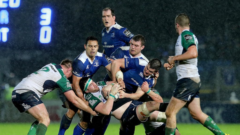 Leinster’s Ben Te’o, Jack McGrath and Johnny Sexton with Eoghan Masterson of Connacht at the Guinness PRO12 in the RDS on Jan 1st, 2016. Photograph: Ryan Byrne/Inpho
