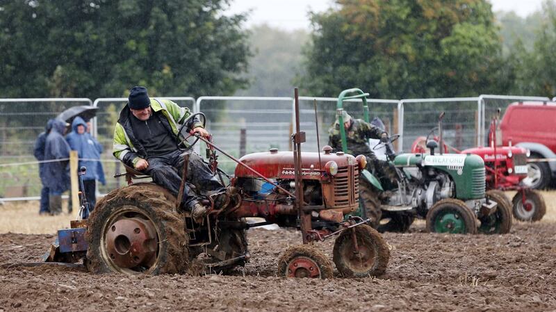 People ploughing after the storm at the National Ploughing Championships 2018 in Screggan, Co Offaly. Photograph: Sam Boal/RollingNews.ie
