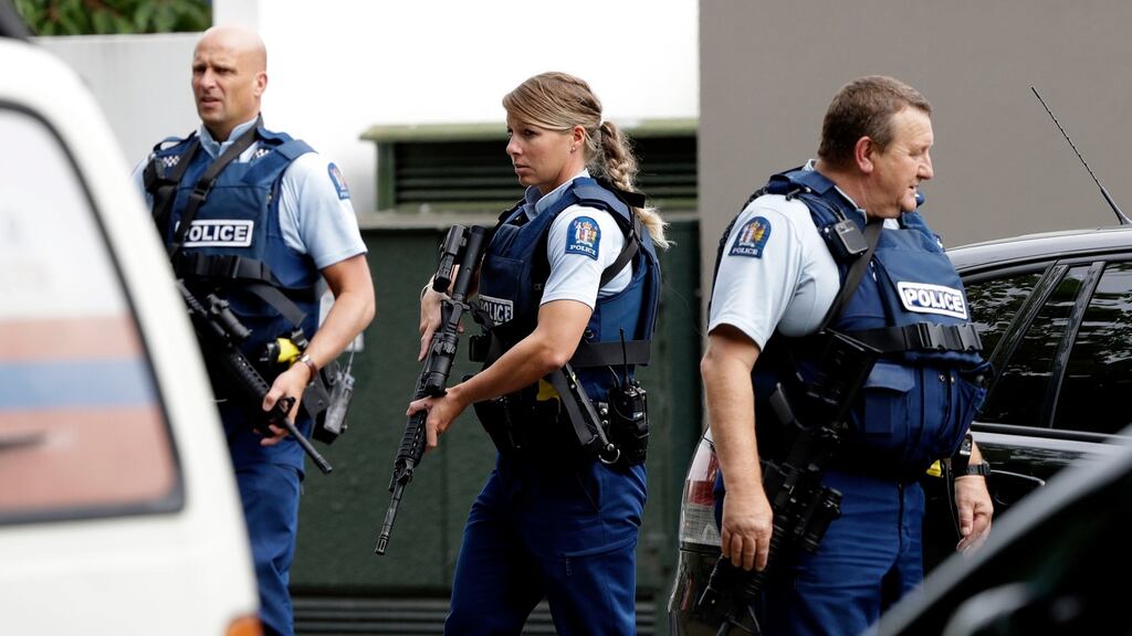 Armed police patrol outside a mosque in central Christchurch, New Zealand on Friday. Photograph: Mark Baker/AP