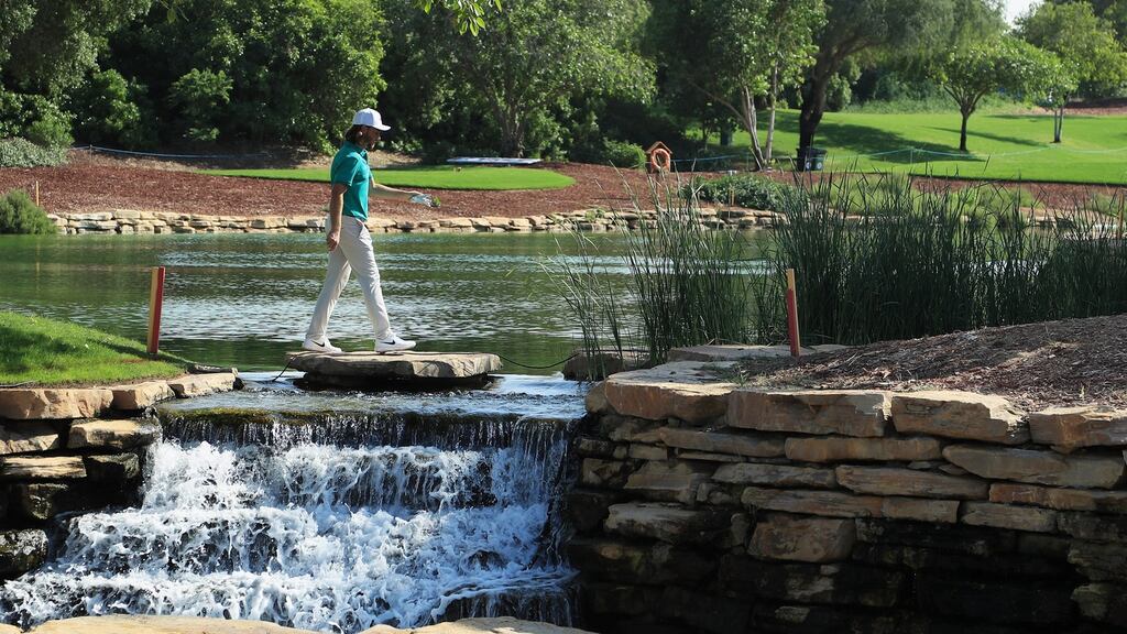 Tommy Fleetwood of England walks over a waterfall during the DP World Tour Championship ProAm held at Jumeirah Golf Estates in Dubai, United Arab Emirates. Photo: Andrew Redington/Getty Images
