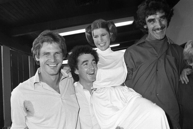 From left to right: actors Harrison Ford, Anthony Daniels, Carrie Fisher and Peter Mayhew take a break from filming a television special in Los Angeles in 1978. Photograph: George Brich/AP/File