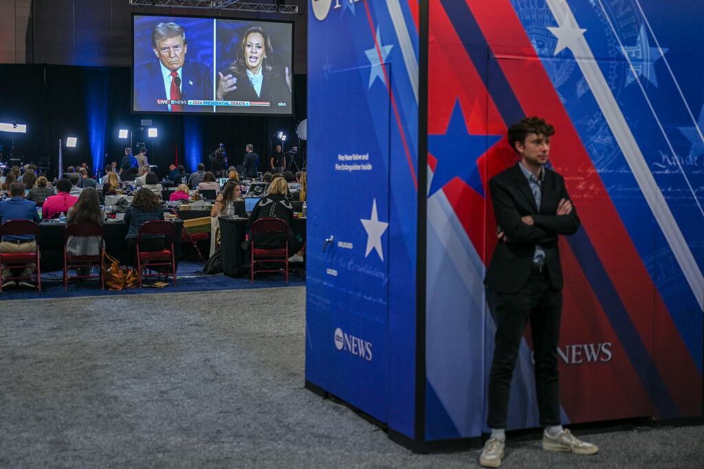 Reporters at the spin room during the presidential debate between vice-president Kamala Harris and former president Donald Trump. Iran, Russia and China are engaging in similar efforts to influence American politics, and all three are scattering their efforts across dozens of platforms. Photograph: Kenny Holston/New York Times