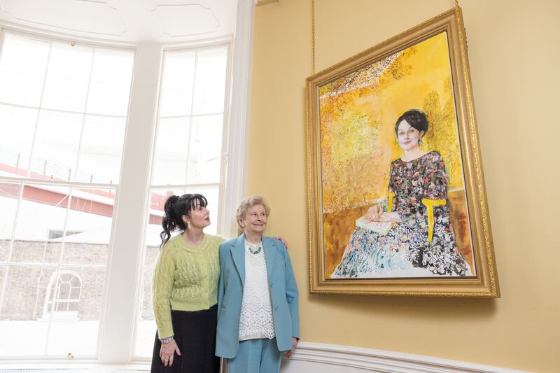 Author Marian Keyes and her mother Mary with The Composition – A Portrait of Marian Keyes, by artist Margaret Corcoran. Photograph: Naoise Culhane