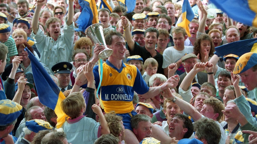 Clare captain Francis McInerney celebrates with fans after the victory over Kerry in the 1992 Munster SFC Final at the Gaelic Grounds in Limerick. Photograph: Inpho