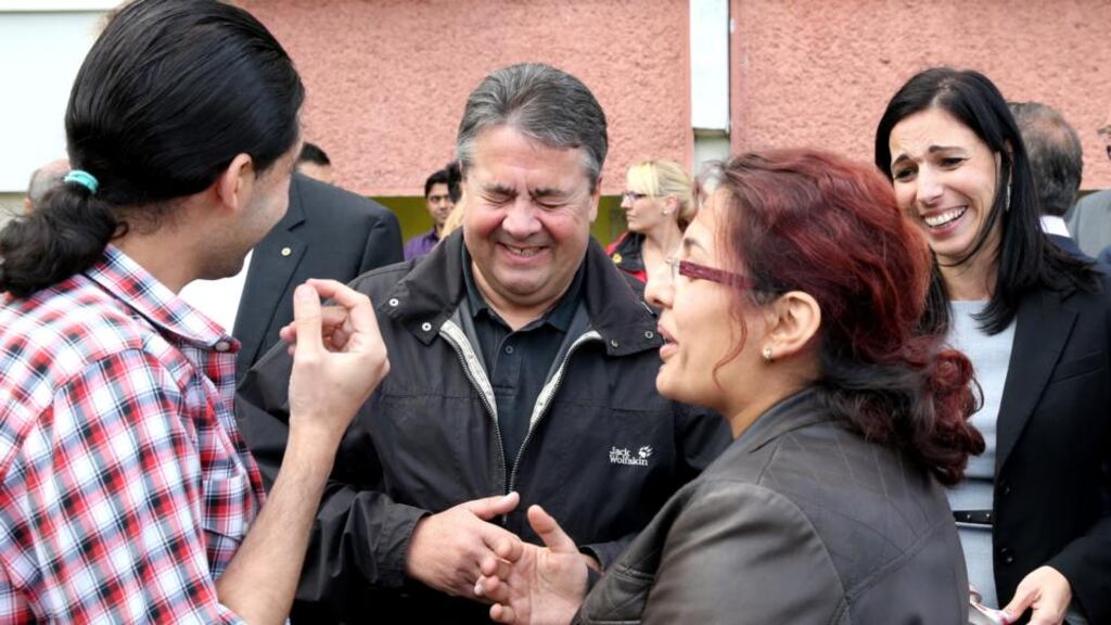 Germany’s deputy chancellor Sigmar Gabriel shares a light moment with residents of a refugee centre in Wolgast, Germany: Germany accepted 202,815 asylum seekers in 2014, the most of any EU country. Photograph: Bernd Wuestneck/EPA