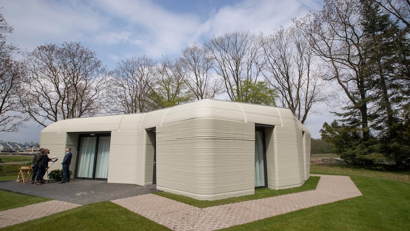 An exterior view of the two-bedroom bungalow resembling a boulder with windows in Eindhoven, the Netherlands. Photograph:  Peter Dejong/AP