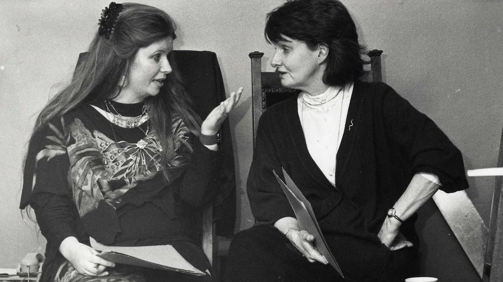 Poets Nuala Ni Dhomhnail (left) and Eavan Boland at a poetry reading celebration by Irish women poets marking  International Women’s Day in 1983. Photograph: Matt Kavanagh
